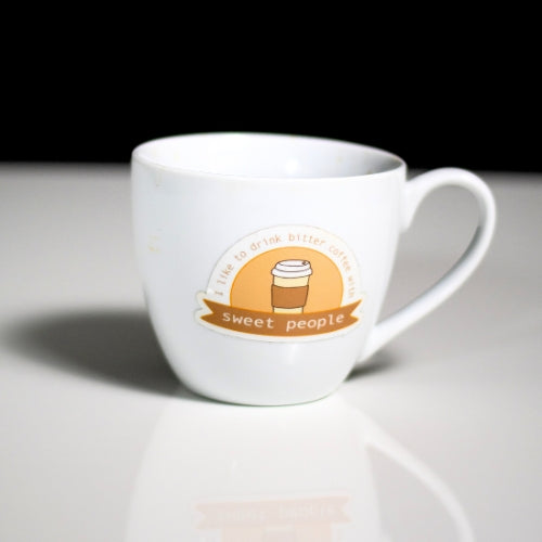 Sweet People coffee quote sticker applied to a white ceramic coffee cup